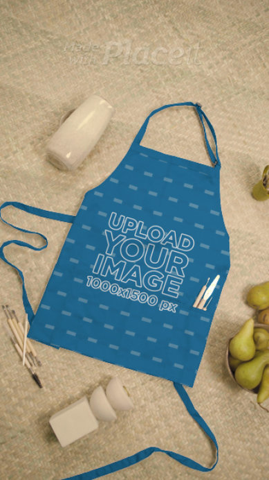 Video of an Apron Surrounded by Ceramic Vases and a Basket with Pears