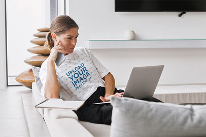 Crop Top Mockup Featuring a Woman Working with a Laptop in the Living Room m18022-r-el2