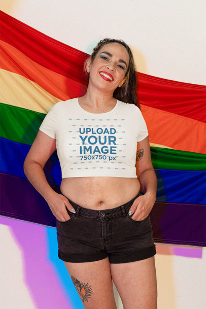 Crop Top Mockup Featuring a Happy Woman Posing Against the Pride Flag m24038