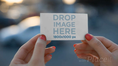 Business Card Video Mockup Being Held By A Woman
