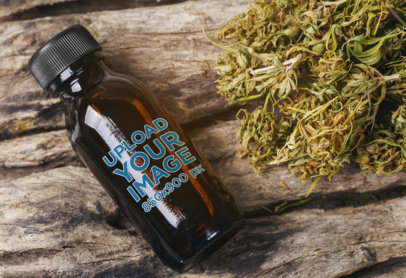 Amber Bottle Mockup Featuring Some Cannabis