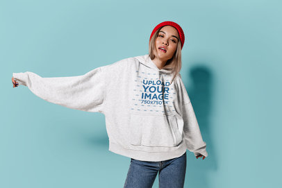 Oversized Hoodie Mockup Featuring a Woman Wearing a Beanie