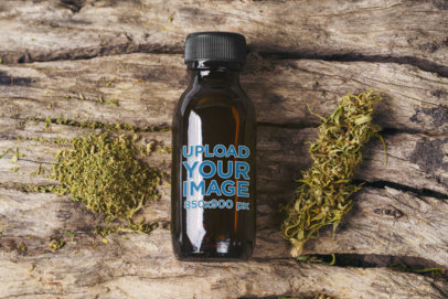 Cannabis-Themed Mockup of an Amber Bottle on a Wooden Surface
