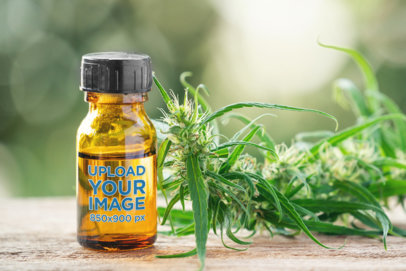 Mockup of an Amber Bottle Next to a Hemp Plant