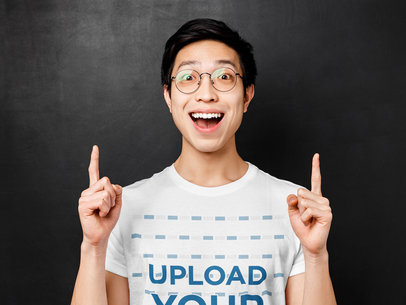T-Shirt Mockup Featuring an Excited Man Pointing Up With His Fingers