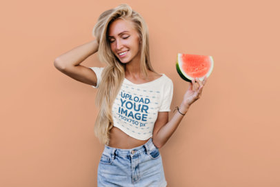 Crop Top Mockup Featuring a Happy Woman Holding a Slice of Watermelon