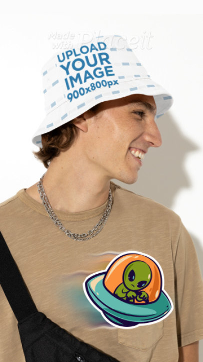 Video of a Bucket Hat Featuring a Happy Man Surrounded by an Animated Alien Sticker