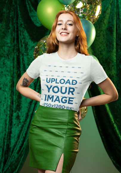 T-Shirt Mockup of a Red-haired Woman Posing in a Green Setting