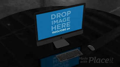 Video of an iMac Standing on a Table in a Dark Room