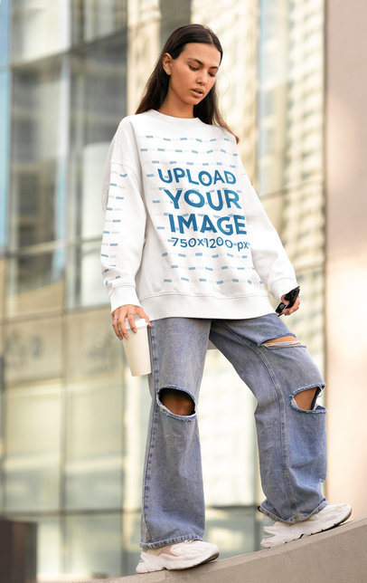 Mockup of a Woman Wearing an Oversized Sweatshirt with a Customizable Sleeve