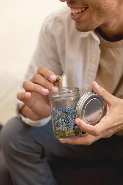 Cannabis-Themed Mockup Featuring a Happy Man Holding a Mason Jar