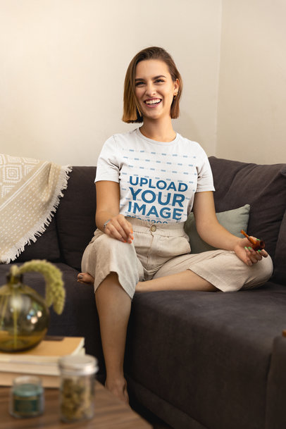 Cannabis-Themed T-Shirt Mockup of a Young Woman Holding a Smoking Pipe M25455