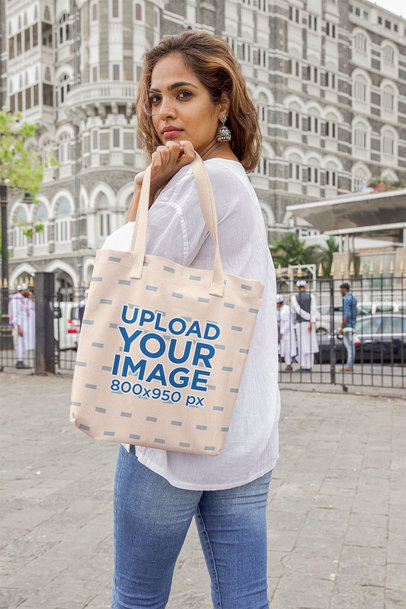 Tote Bag Mockup of a Woman Posing in a Street in India