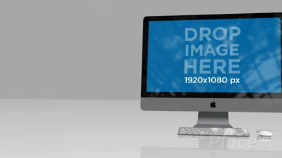 Video of an iMac Standing on a Flat Reflective Surface