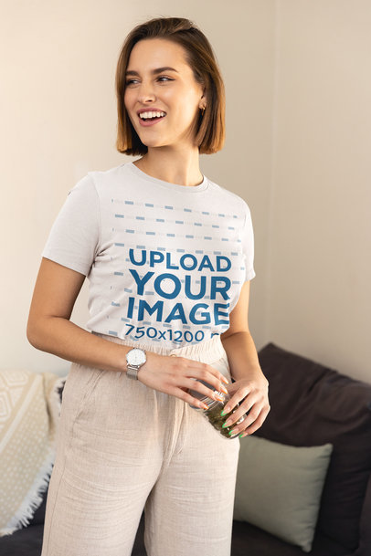 Bella Canvas T-Shirt Mockup Featuring a Woman Holding a Jar With Cannabis Buds