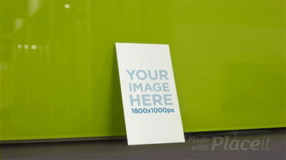 Vertical Business Card Falling in Stop Motion From Green Wall