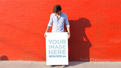 Man Being Funny Holding a Poster Against a Red Wall in Stop Motion