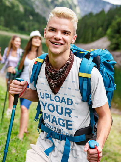 T-Shirt Mockup of a Smiling Man on a Hike with His Friends