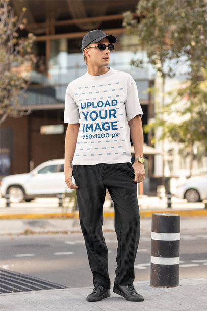 Mockup of a Man With Sunglasses Wearing an Oversized Tee
