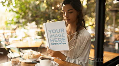 Pretty Student Reading a Book in Stop Motion at a Cafe