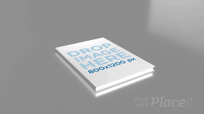 Video of a Hardcover Book Lying on a Flat Gray Surface