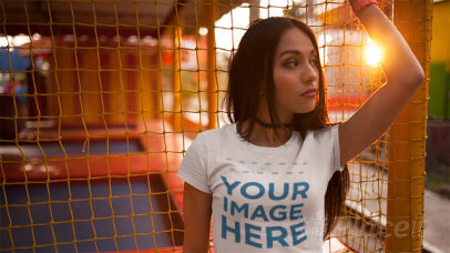Young Girl Wearing a T-Shirt Stop Motion and a Choker Near a Trampoline a13512