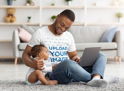 T-Shirt Mockup Featuring a Man Hugging his Baby