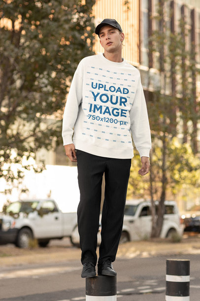 Mockup of a Man in the Street Wearing an Oversized Sweatshirt 