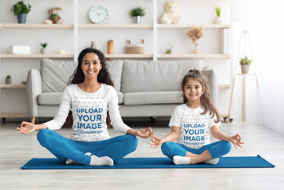 Long Sleeve Tee and T-Shirt Mockup of a Smiling Woman and Daughter Meditating at Home