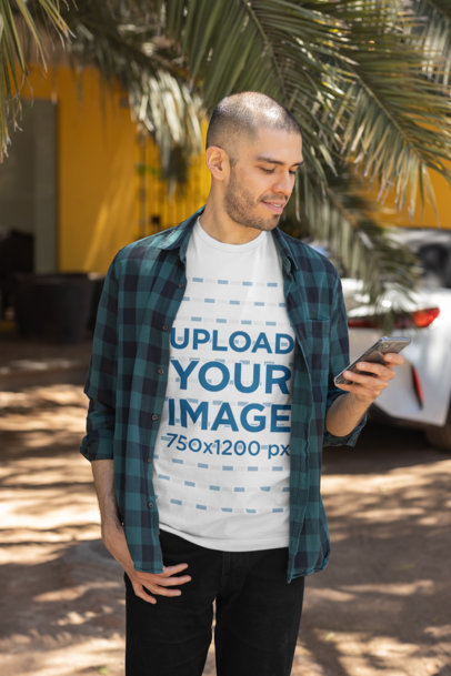 T-Shirt Mockup Featuring a Man with a Buzz Cut Wearing a Plaid Shirt