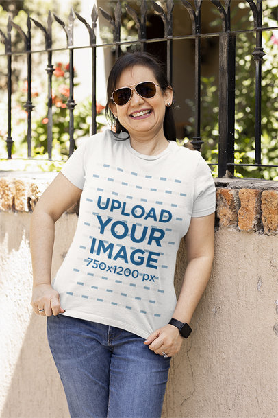 Mockup of a Happy Woman Showing the Front Side of Her T-Shirt