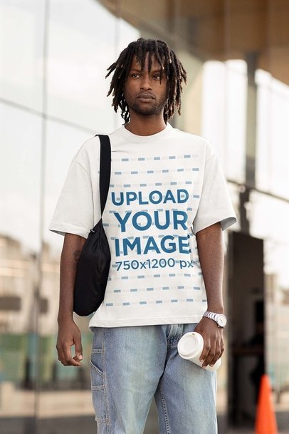 Mockup of a Man Wearing an Oversized T-Shirt on The Street