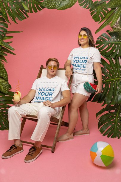 V-neck T-Shirt Mockup of a Couple Posing in a Summer-Themed Studio 