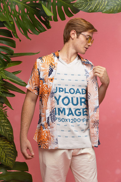 V-Neck T-Shirt Mockup of a Man Wearing a Tropical Shirt and Sunglasses while Posing at a Studio