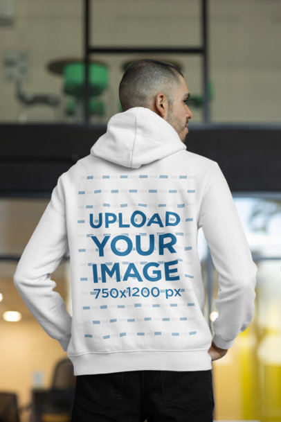 Back View of a Man Wearing a Hoodie at The Office