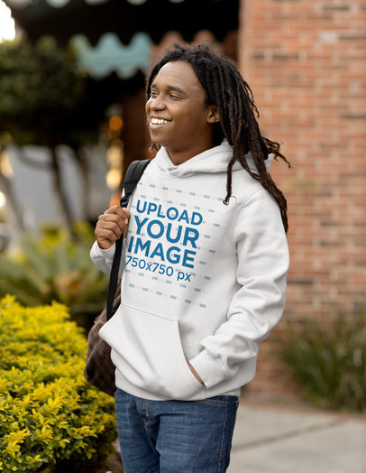 Mockup of a Man with Locs Wearing a Hoodie and Carrying a Backpack 