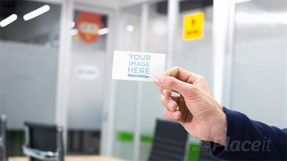 Mockup of a Hand Holding a Business Card Stop Motion in a  Professional Environment