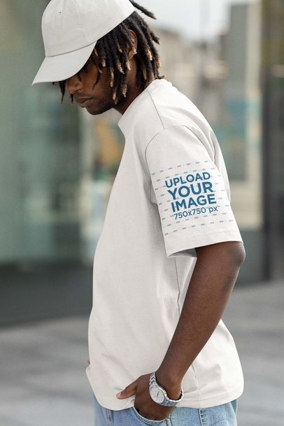 Mockup of a Man Wearing an Oversized T-Shirt with a Customizable T-Shirt Sleeve 