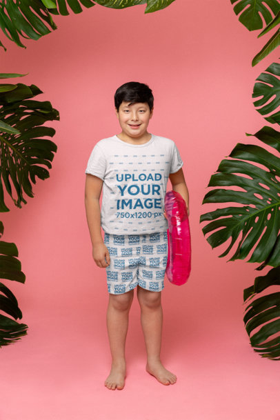 T-shirt Mockup of a Boy Wearing Sublimated Swimming Trunks and Holding a Pool Float