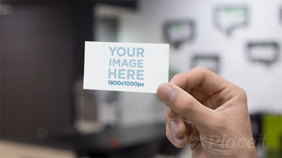 Closeup of a Business Card Stop Motion Being Held at an Office