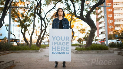 Young Woman Holding a Big Poster Going Back And Forth in Stop Motion