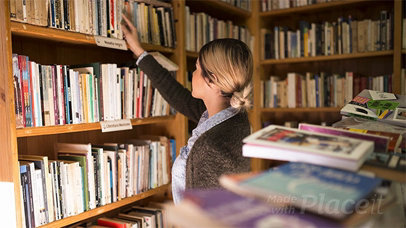 Woman Picking Up a Book in Stop Motion From Library