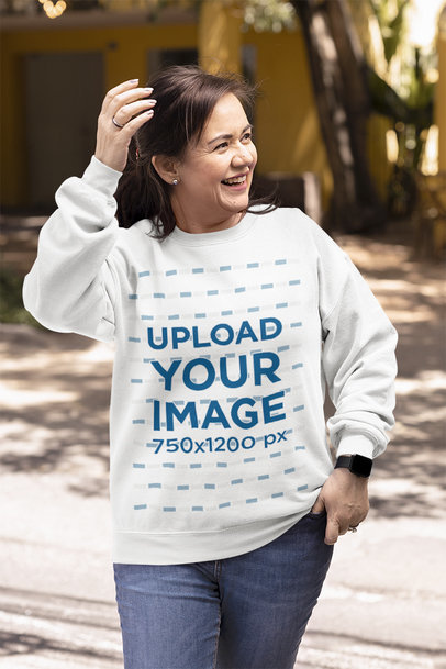 Sweatshirt Mockup Featuring a Happy Woman on the Street