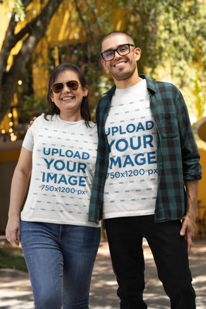 T-Shirt Mockup Featuring a Man and a Woman Posing Together