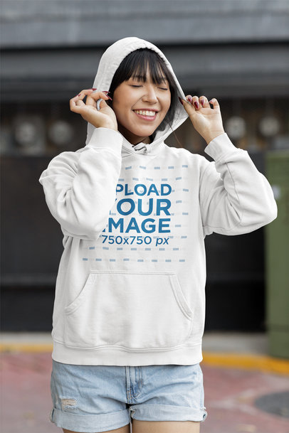 Mockup of a Smiling Woman with Bangs Wearing a Pullover Hoodie 