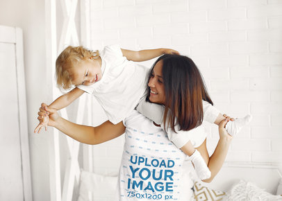 Mockup of a Smiling Woman Wearing a T-shirt and Playing with her Child M1542-r-el2