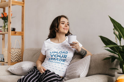 Mockup of a Pregnant Woman at Home Wearing a Round-Neck Tee