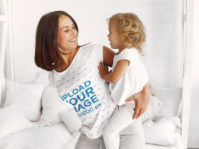 T-Shirt Mockup Featuring a Mother Carrying her Little Girl