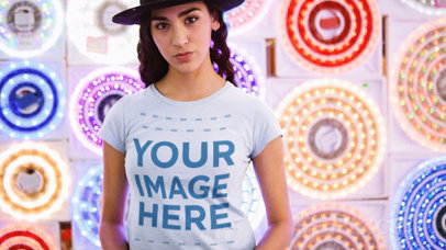 Trendy Woman Wearing a Tshirt Cinemagraph and a Hat Against Flashing Circle Lights
