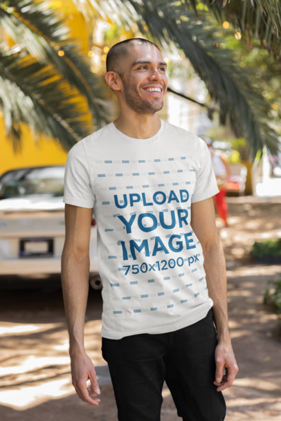 Mockup of a Happy Man Wearing a Round-Neck Tee on a Spring Day